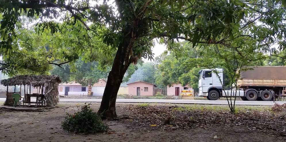 Photograph of a road, a truck to the right